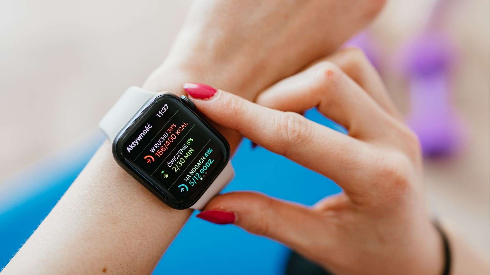 Person checking calorie burn and activity stats on a smartwatch during a workout